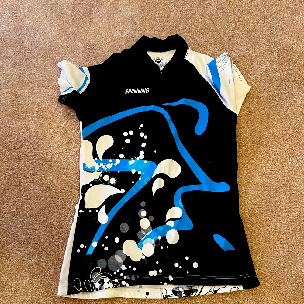 Stretchy cyclist shirt with 3 pockets on back for water bottles, snacks, etc.